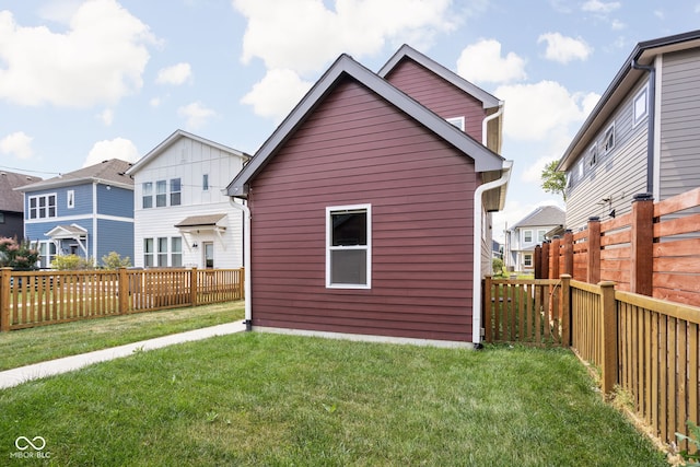 1935 Cornell Ave, Indianapolis, IN 46202 - back of house with a fenced backyard, an outdoor structure, and a residential view
