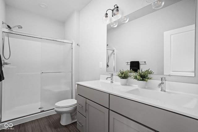 1935 Cornell Ave, Indianapolis, IN 46202 - full bathroom featuring double vanity, wood finished floors, and a stall shower