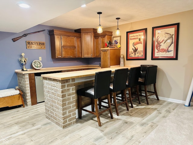 9975 Woodstock Way, Fishers, IN 46037 - bar featuring light wood-style floors, pendant lighting, and recessed lighting