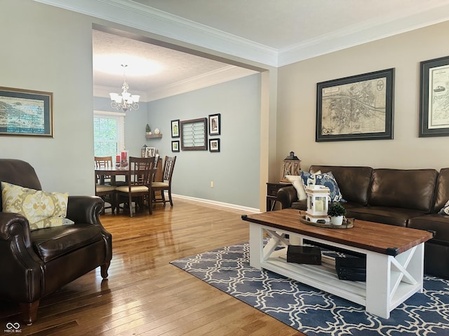 9975 Woodstock Way, Fishers, IN 46037 - living area with a chandelier, hardwood / wood-style flooring, and crown molding