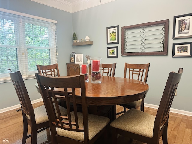 9975 Woodstock Way, Fishers, IN 46037 - dining area with light wood-style floors and crown molding