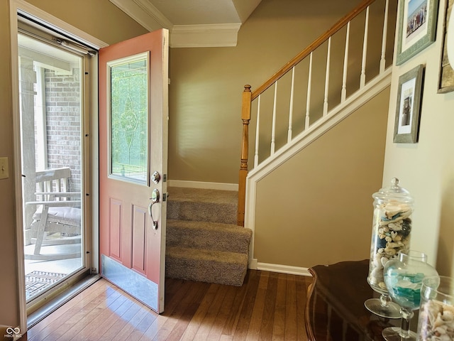 9975 Woodstock Way, Fishers, IN 46037 - entrance foyer featuring ornamental molding, hardwood / wood-style flooring, and stairway