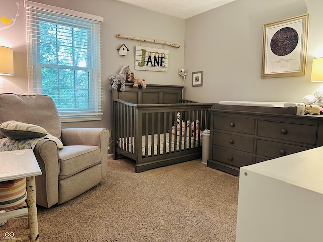 9975 Woodstock Way, Fishers, IN 46037 - bedroom with multiple windows, light colored carpet, and a crib