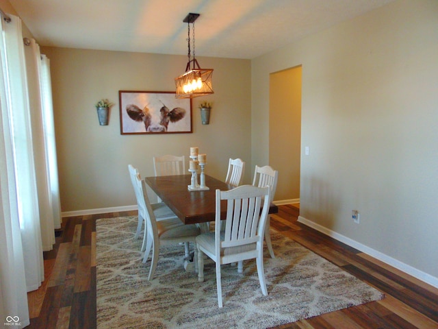 2703 Night Hawk Rd, Greenwood, IN 46143 - dining space featuring wood finished floors and a chandelier