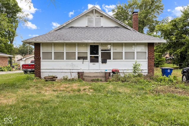 913 S Hall St, Princeton, IN 47670 - view of front of home with a shingled roof, a chimney, entry steps, a front yard, and brick siding