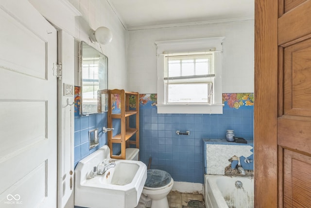913 S Hall St, Princeton, IN 47670 - bathroom with tile walls, a bath, and crown molding