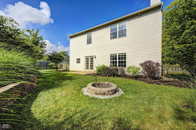 1143 Kinross Dr, Avon, IN 46123 - rear view of property featuring a fire pit, french doors, and a patio area