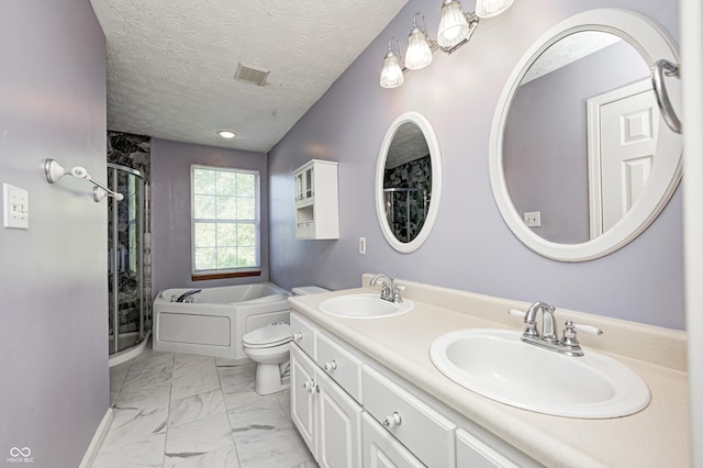 1143 Kinross Dr, Avon, IN 46123 - bathroom featuring a stall shower, marble finish floors, double vanity, a garden tub, and a textured ceiling