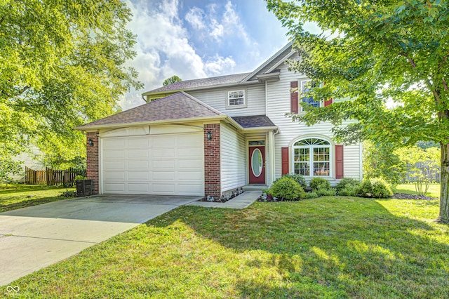 1143 Kinross Dr, Avon, IN 46123 - traditional home featuring a garage, concrete driveway, a shingled roof, and brick siding