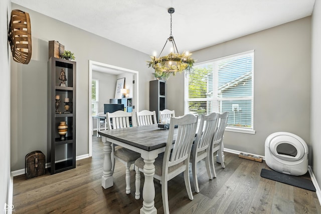 8612 Weaver Woods Pl, Fishers, IN 46038 - dining space with a chandelier, dark wood-style floors, and healthy amount of natural light
