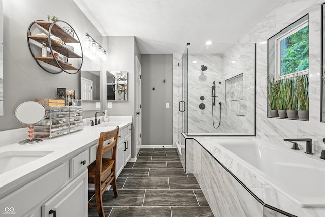 8612 Weaver Woods Pl, Fishers, IN 46038 - full bath with double vanity, a bath, a marble finish shower, marble finish flooring, and recessed lighting