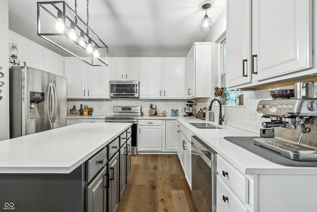 8612 Weaver Woods Pl, Fishers, IN 46038 - kitchen with appliances with stainless steel finishes, white cabinetry, dark wood-style flooring, and gray cabinets