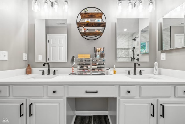 8612 Weaver Woods Pl, Fishers, IN 46038 - bathroom featuring double vanity, a stall shower, and wood finished floors