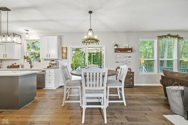 8612 Weaver Woods Pl, Fishers, IN 46038 - dining space featuring plenty of natural light, wood finished floors, and a chandelier