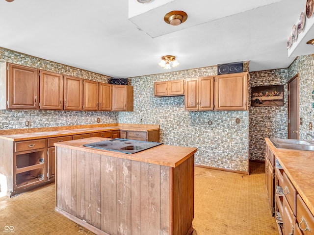 4484 S County Road 315 W, Greencastle, IN 46135 - kitchen featuring a kitchen island, stovetop, and light countertops