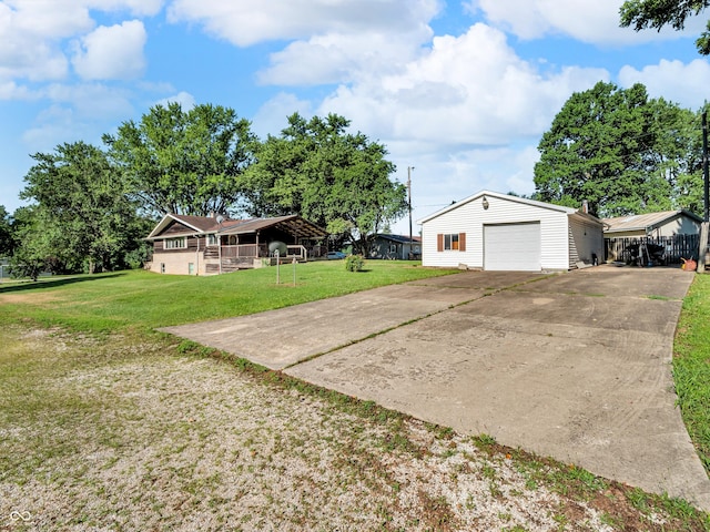 4484 S County Road 315 W, Greencastle, IN 46135 - view of green lawn featuring driveway, a garage, and an outdoor structure