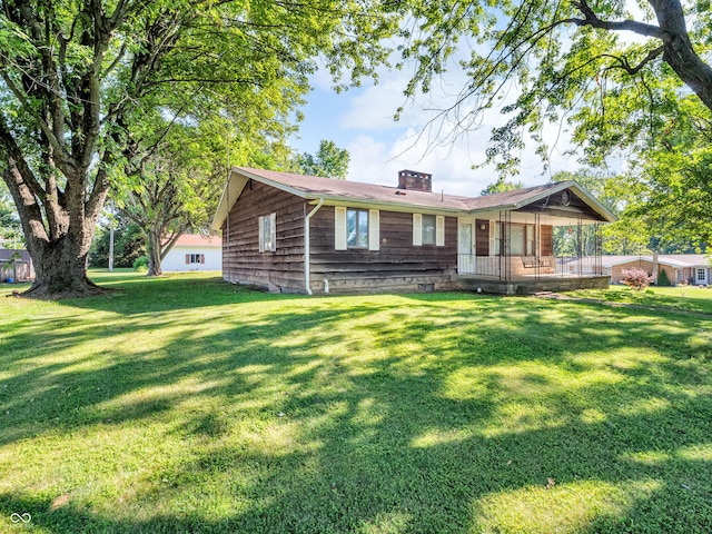 4484 S County Road 315 W, Greencastle, IN 46135 - ranch-style home with a chimney, a front yard, and covered porch