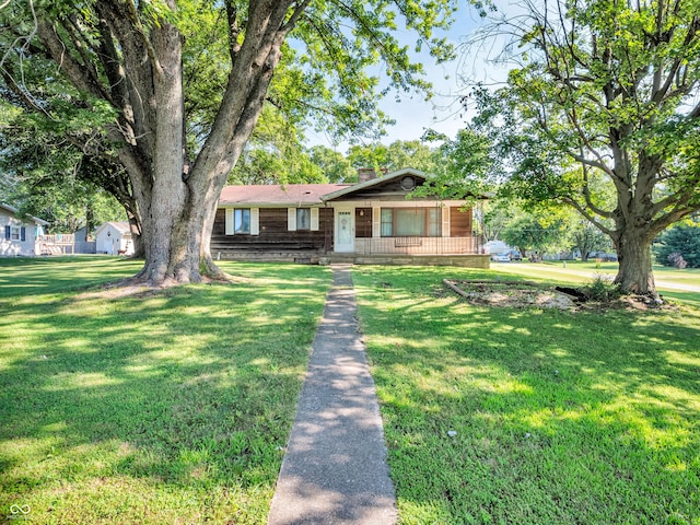 4484 S County Road 315 W, Greencastle, IN 46135 - view of front facade featuring a chimney, a front lawn, and covered porch