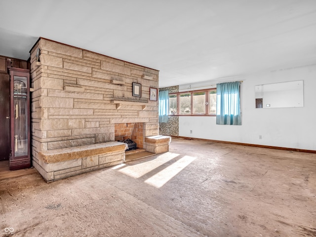 4484 S County Road 315 W, Greencastle, IN 46135 - unfurnished living room featuring a stone fireplace and baseboards