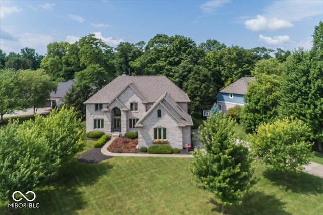 13023 Water Ridge Dr, Mccordsville, IN 46055 - french country style house featuring a front yard and stone siding
