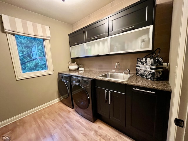 13023 Water Ridge Dr, Mccordsville, IN 46055 - laundry area with cabinet space, washing machine and dryer, and light wood-style floors