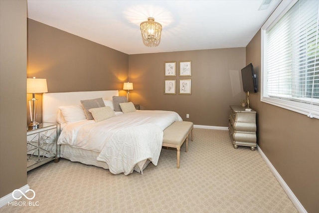 13023 Water Ridge Dr, Mccordsville, IN 46055 - carpeted bedroom with baseboards and a chandelier
