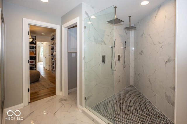 13023 Water Ridge Dr, Mccordsville, IN 46055 - full bathroom featuring a marble finish shower, a walk in closet, recessed lighting, and marble finish floors