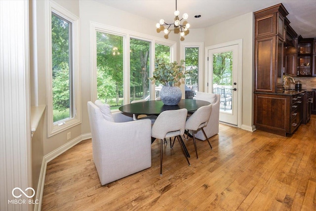 13023 Water Ridge Dr, Mccordsville, IN 46055 - dining room with a chandelier and light wood finished floors