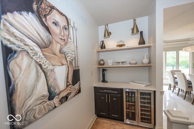 13023 Water Ridge Dr, Mccordsville, IN 46055 - indoor dry bar with beverage cooler and light wood-type flooring