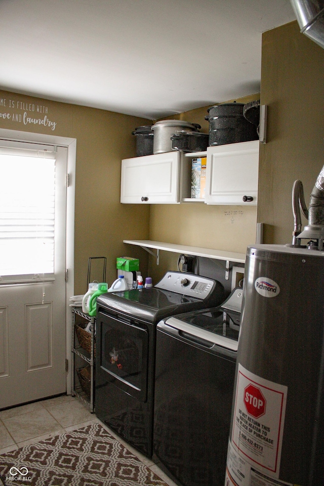 1042 S County Road 600 W, Danville, IN 46122 - laundry area with cabinet space, washing machine and clothes dryer, gas water heater, and light tile patterned flooring