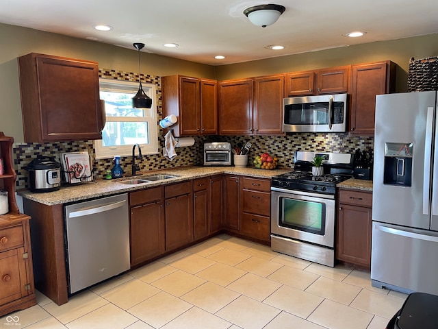 1042 S County Road 600 W, Danville, IN 46122 - kitchen featuring stainless steel appliances, decorative backsplash, pendant lighting, light stone countertops, and recessed lighting