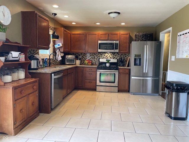 1042 S County Road 600 W, Danville, IN 46122 - kitchen featuring appliances with stainless steel finishes, tasteful backsplash, stone counters, and recessed lighting