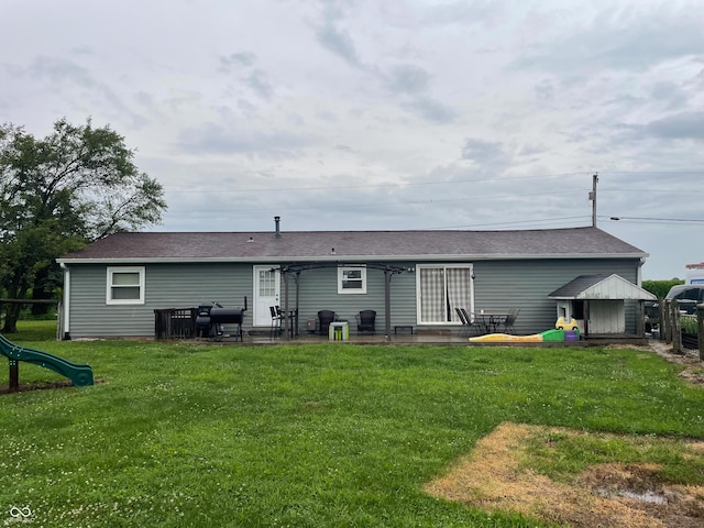 1042 S County Road 600 W, Danville, IN 46122 - back of property featuring roof with shingles and a patio area