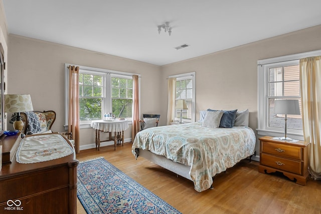 613 5th St, Columbus, IN 47201 - bedroom with wood finished floors and crown molding