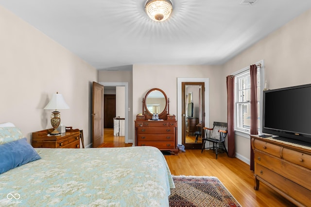 613 5th St, Columbus, IN 47201 - bedroom with light wood-type flooring and baseboards
