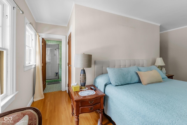 613 5th St, Columbus, IN 47201 - bedroom featuring light wood finished floors, crown molding, and ensuite bathroom