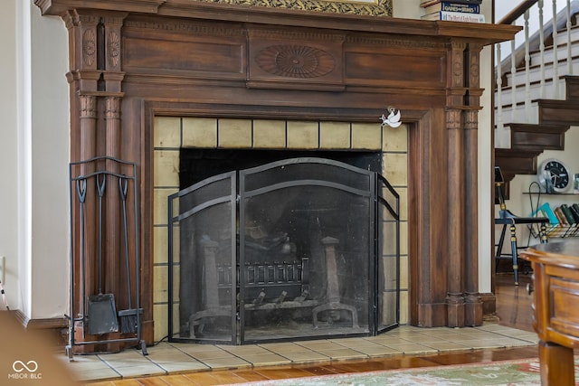 613 5th St, Columbus, IN 47201 - detailed view of a tile fireplace and wood finished floors