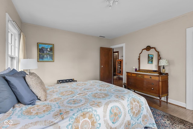 613 5th St, Columbus, IN 47201 - bedroom featuring wood finished floors and baseboards
