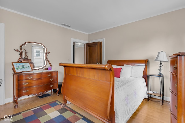 613 5th St, Columbus, IN 47201 - bedroom with wood finished floors and crown molding