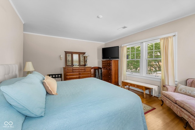 613 5th St, Columbus, IN 47201 - bedroom featuring crown molding and wood finished floors