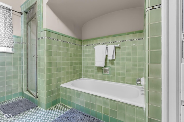 613 5th St, Columbus, IN 47201 - full bathroom featuring a shower stall, a garden tub, and tile walls