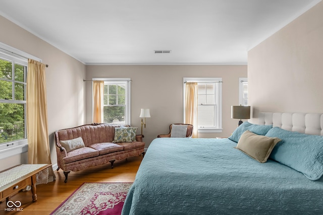 613 5th St, Columbus, IN 47201 - bedroom featuring wood finished floors and ornamental molding