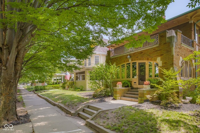 613 5th St, Columbus, IN 47201 - view of front of property with a balcony and brick siding