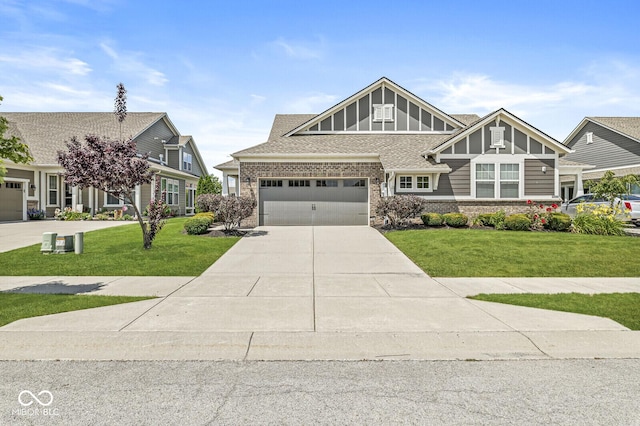 10868 Matherly Way, Noblesville, IN 46060 - craftsman house featuring driveway, a front lawn, a garage, and brick siding