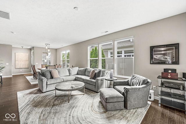 10868 Matherly Way, Noblesville, IN 46060 - living area with dark wood-type flooring and a textured ceiling