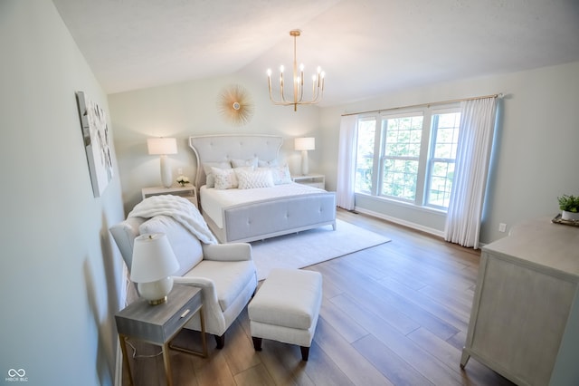 6802 Chorleywood Cir, Indianapolis, IN 46259 - bedroom with a chandelier, wood finished floors, and vaulted ceiling