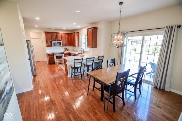 6802 Chorleywood Cir, Indianapolis, IN 46259 - dining room featuring a chandelier, light wood finished floors, and recessed lighting