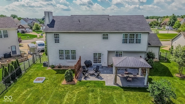 6802 Chorleywood Cir, Indianapolis, IN 46259 - rear view of property featuring a gazebo, a chimney, a patio area, and a residential view