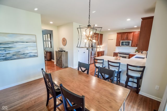 6802 Chorleywood Cir, Indianapolis, IN 46259 - dining space with wood finished floors, recessed lighting, and a chandelier