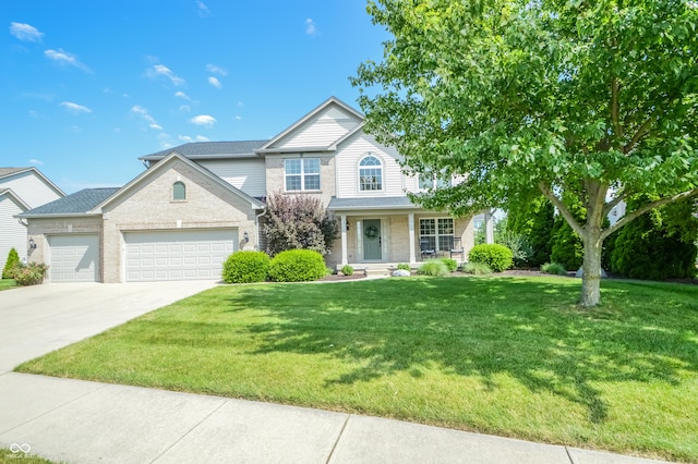 6802 Chorleywood Cir, Indianapolis, IN 46259 - traditional-style home featuring an attached garage, concrete driveway, a front lawn, brick siding, and covered porch